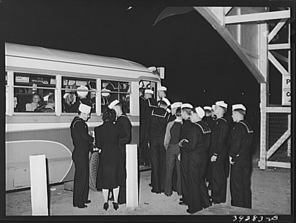 Group of sailors entering bus