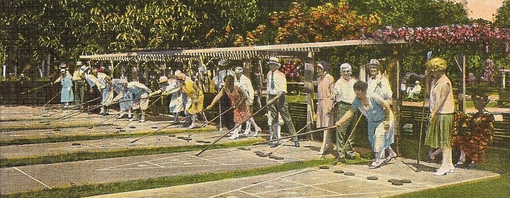 Outdoor shuffleboard match in progress